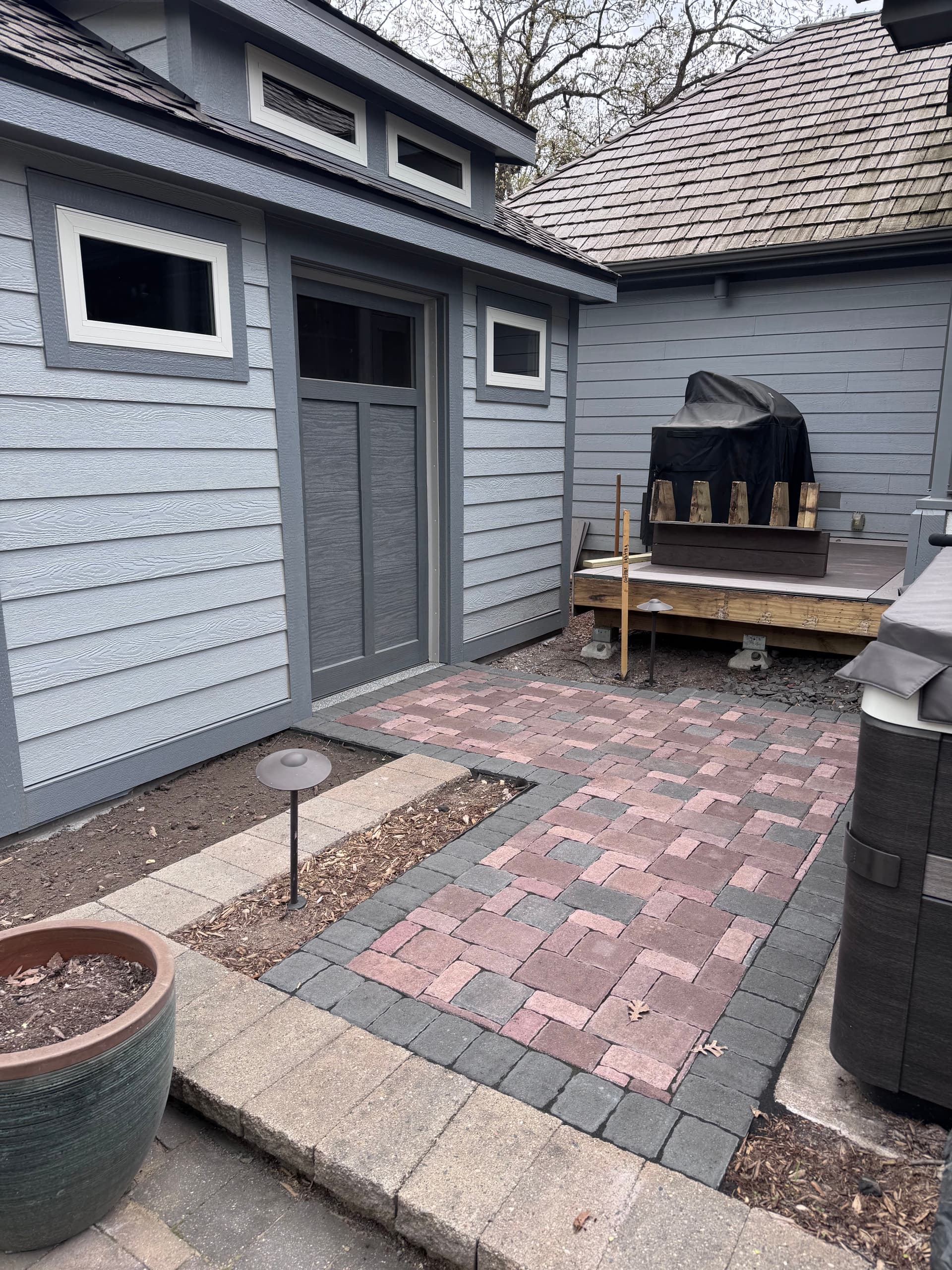 Gallery photos for Paver Walkway and Retaining Wall Install Around a Backyard Shed: Image #1